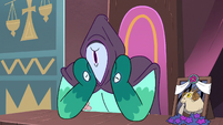 S3E29 Rhombulus covers his face with a hood