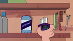S2E27 Marco Diaz picking up a bottle of cologne