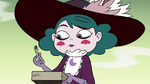 S4E10 Eclipsa examining a piece of charred book