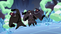 Masked men watch as the crystals surround them