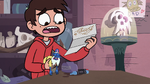 S3E31 Note opens up in Marco Diaz's hand