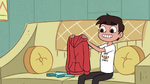 S3E8 Marco Diaz holding his hoodie