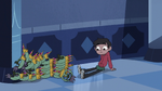 S3E6 Marco Diaz knocks over stacks of Ludo masks