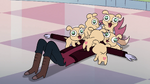 S4E13 Tom under a pile of laser puppies