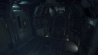 Tractor beam station on the command pod lower deck and exit door