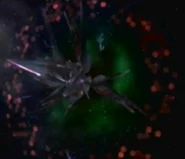 The largest of the missiles, Degram, exits an aparoid warp portal.