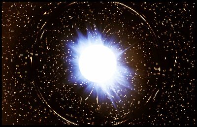 Neutron Star - Note how its immense gravity bends light around it.