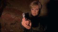 Samantha Carter pointing the Taurus PT92 at Jonas Hanson