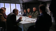 SG-1, the crew of the Prometheus and members of the Tagrean government in the mess hall.[7]