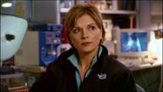 Dr. Janet Fraiser wearing a branded jacket.