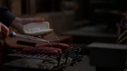 Maybourne stealing a hot dog from the grill at O'Neill's house (SG1: "Paradise Lost")