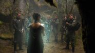 The outfit from the back and her pendant's shield in use.