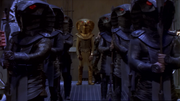 Apophis and his Serpent Guards in the Embarkation Room of the vacant Stargate Command.