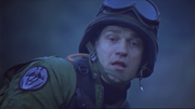 An infant Goa'uld symbiote entering Kawalsky's body via his right ear.