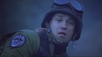 A infant Goa'uld symbiote entering Kawalsky's body via his right ear