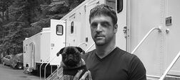 Nels Lennarson on the set of "Stargate Atlantis" with his dog, "Change".