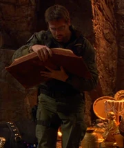 Daniel Jackson holding the book.
