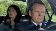 Vala escorted by fake SGC personnel.
