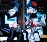 Charlotte Avery as Volta, Carole Amphlett as Wrench