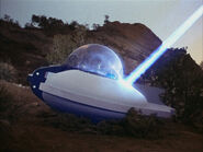 Lazarus's ship struck by phaser fire.