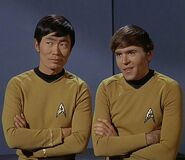 Hikaru Sulu and Pavel Chekov attend James T. Kirk's hearing.