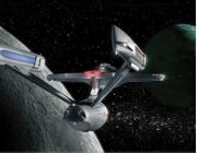 The Enterprise-A approaches planet Varba II after detecting an alien distress call.