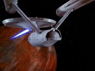USS Enterprise phasers Lazarus's spaceship from orbit.