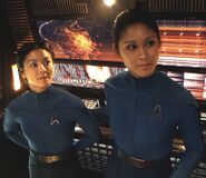 Two command division officers in duty uniforms in 2233.