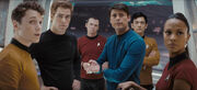 The senior officers turn from their discussions to see Spock return to the bridge