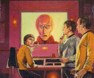 Pavel Chekov reacts to the image of Balok's puppet on the bridge viewscreen as Spock and James T. Kirk look on.
