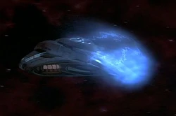 A Tachyon burst impacting the shields of a Venture-class.
