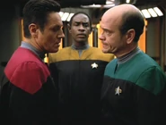 The crew discuss Janeway's injury.