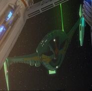 A Romulan bird-of-prey firing on the USS Archon. (November)