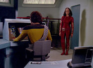 Worf and K'Ehleyr in the tactical room of the Enterprise-D.