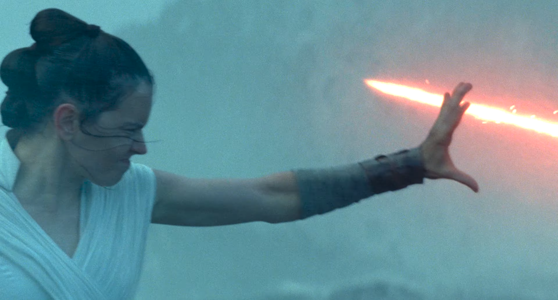 Rey uses Force Stasis to block Kylo Ren's lightsaber strike.