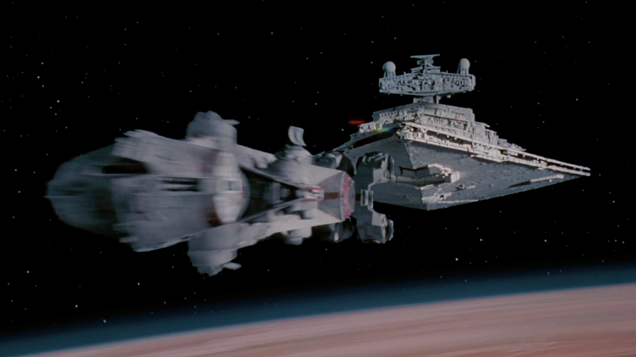 The Imperial Star Destroyer Devastator chases down the Tantive IV.