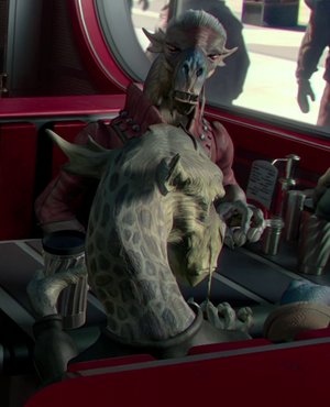 Seboca and Rednax sit oppostie one another in a booth at Dex's Diner.