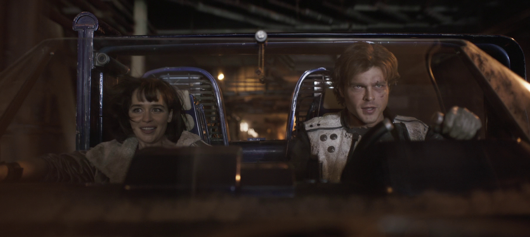 Han and Qi'ra escaping on a landspeeder.