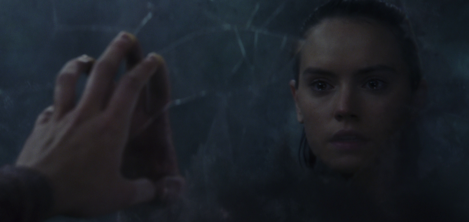 Rey faces her own reflection in the cave.