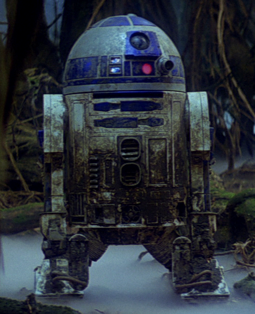 R2-D2 covered in mud after surviving his encounter with the dragonsnake.