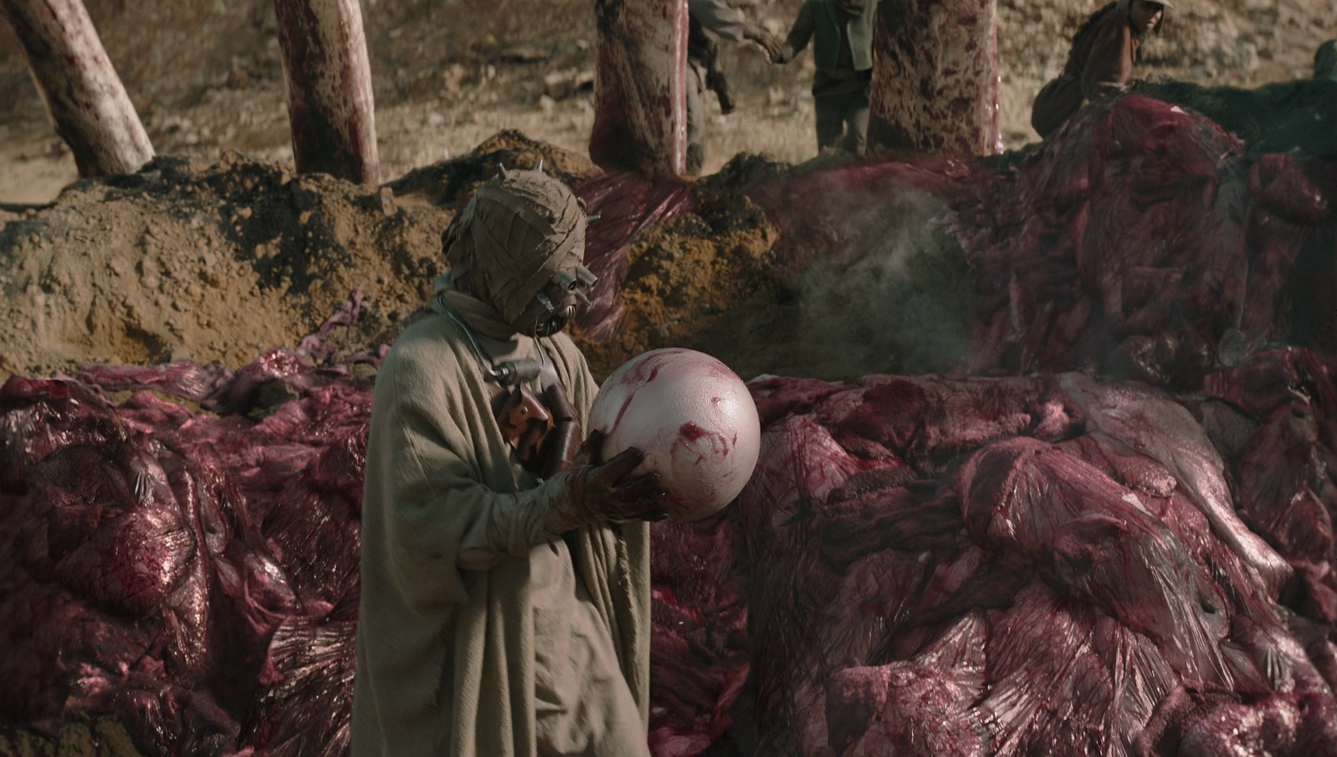 A Tusken Raider holding an enormous krayt dragon pearl.