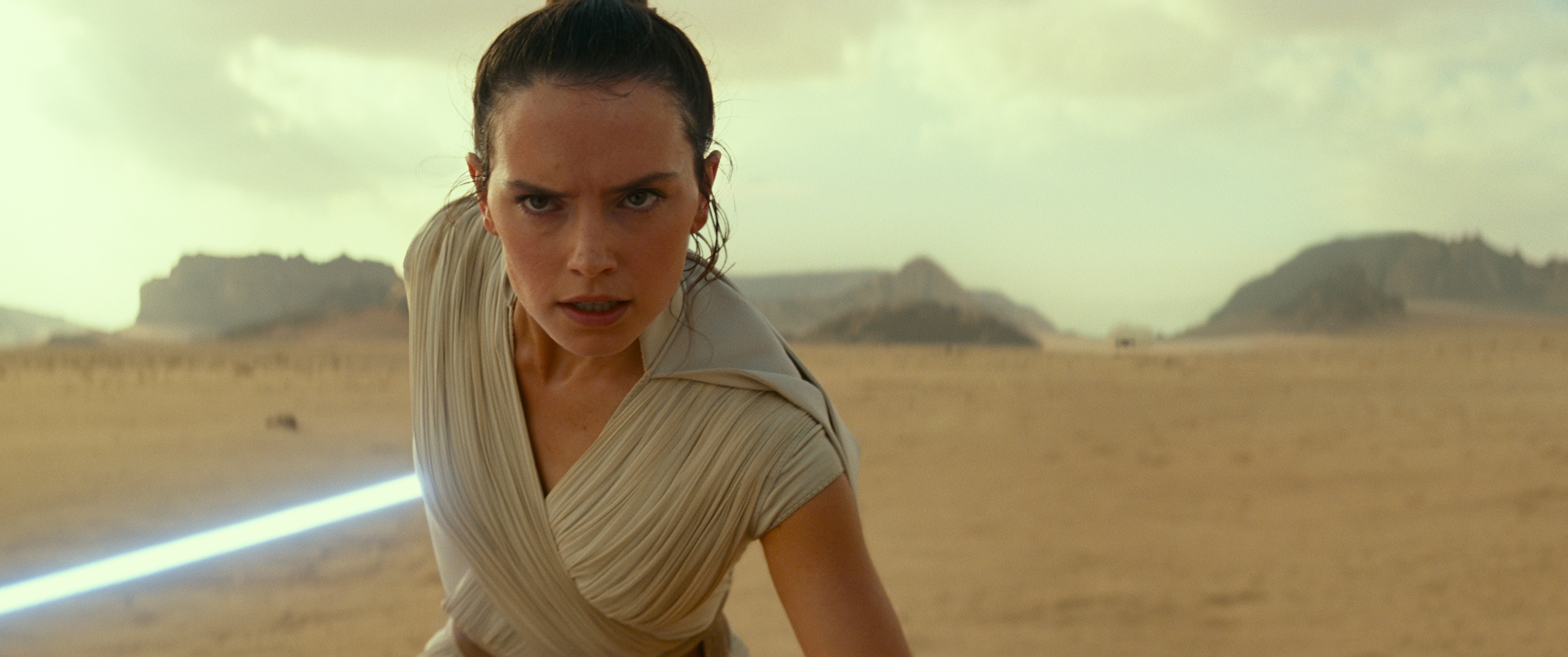 Rey wields her lightsaber on Pasaana.