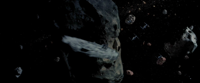 The Imperials pursue the Millennium Falcon through an asteroid field.