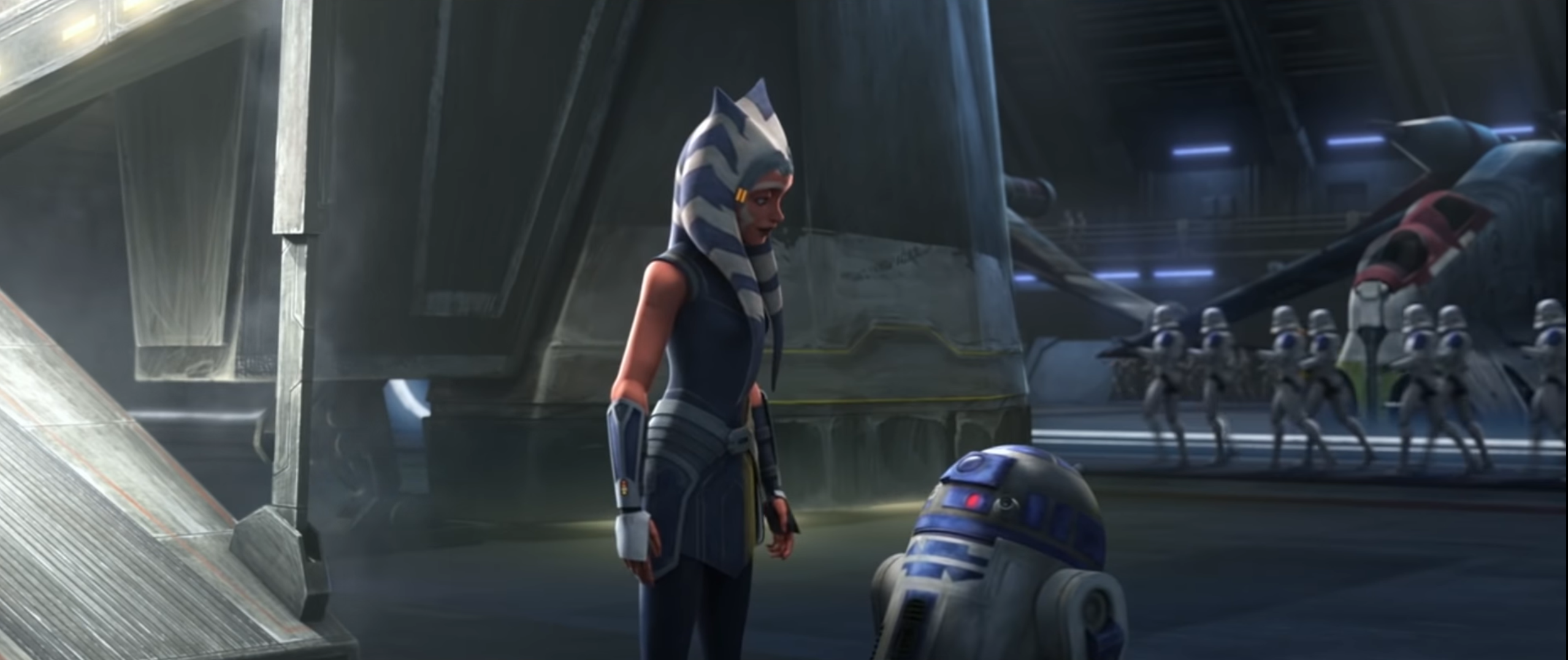 Ahsoka is greeted by R2 after landing on the Venator.