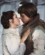 Luke Skywalker and Leia Organa about to kiss