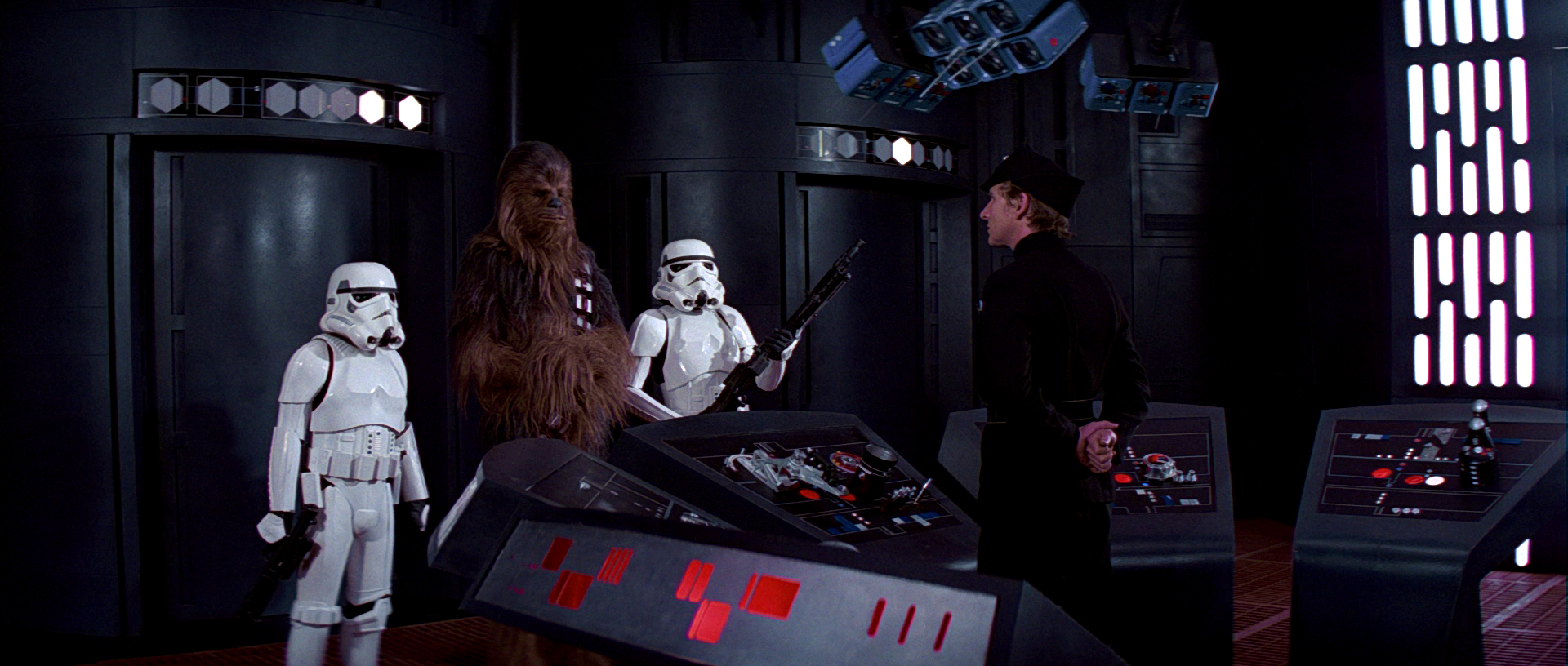 Luke and Han pose as stormtroopers with Chewbacca as their fake prisoner.