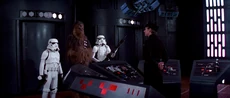 Luke and Han pose as stormtroopers with Chewbacca as their fake prisoner.