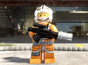 A LEGO version of Theron Nett in his helmet and flight suit carrying a blaster rifle.