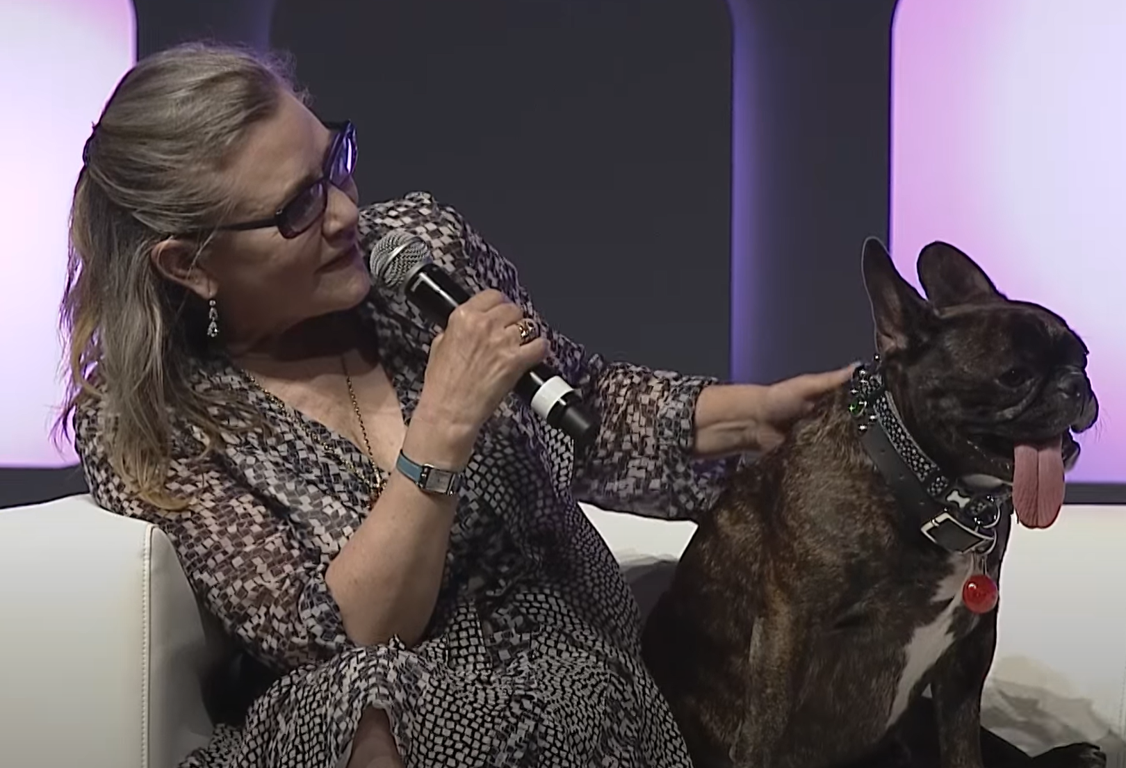 Carrie Fisher and her pet dog Gary at Celebration 2016