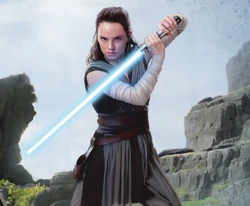 Rey with the lightsaber on Ahch-To